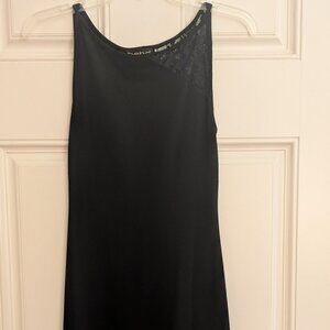 Bebe sleeveless sheath dress with asymmetrical lace detail